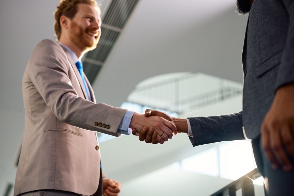 close up of corporate managers shaking hands in th 2024 12 13 22 15 51 utc